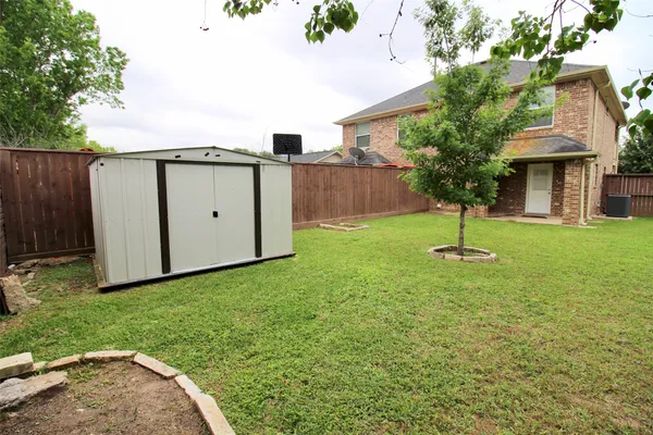 a view of a back yard of the house