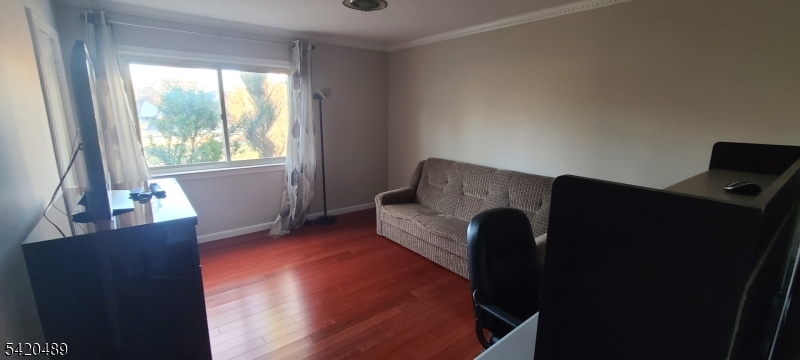 5 Tower Road Livingston, NJ 07039 - Photo 5 of 7 a living room with furniture and a large window