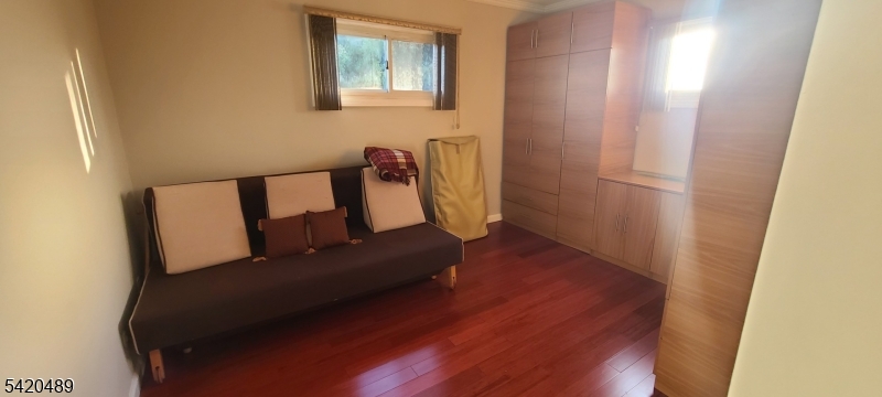 5 Tower Road Livingston, NJ 07039 - Photo 7 of 7 a living room with furniture and a wooden floor