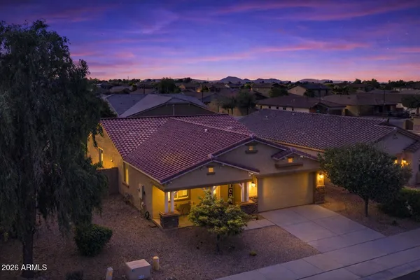 a view of a patio with a table under an umbrella