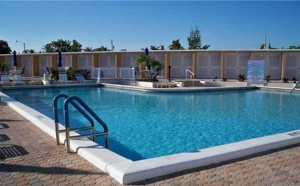 6600 Northeast 22nd Way, Unit 2332 Fort Lauderdale, FL 33308 - Photo 23 of 29 a view of swimming pool with outdoor seating and plants