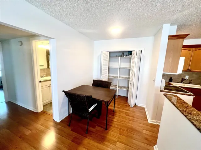 a view of a kitchen with a table and a window
