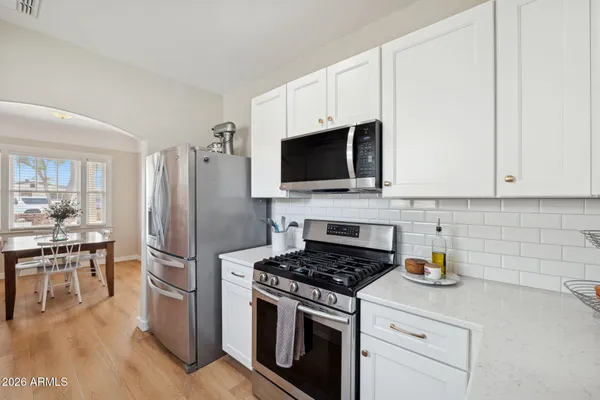 a kitchen with a sink stove and microwave