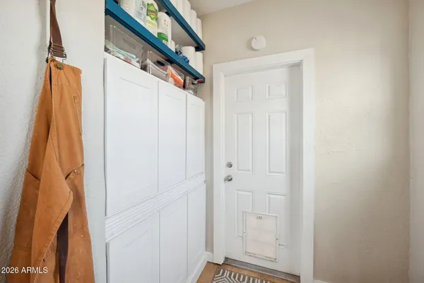 a kitchen with stainless steel appliances granite countertop a sink and a white cabinets