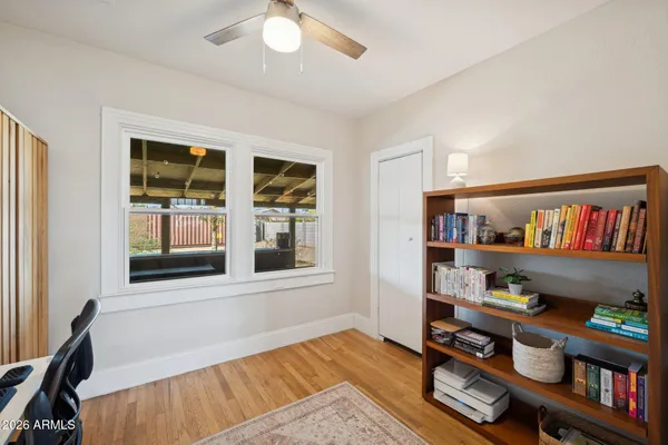 a view of an empty room with workspace and window