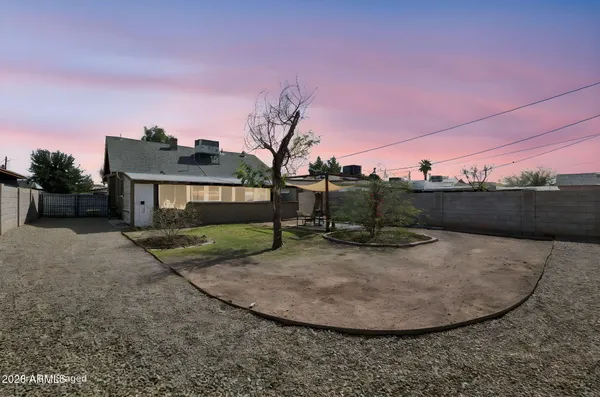 a view of a tiny house with a yard