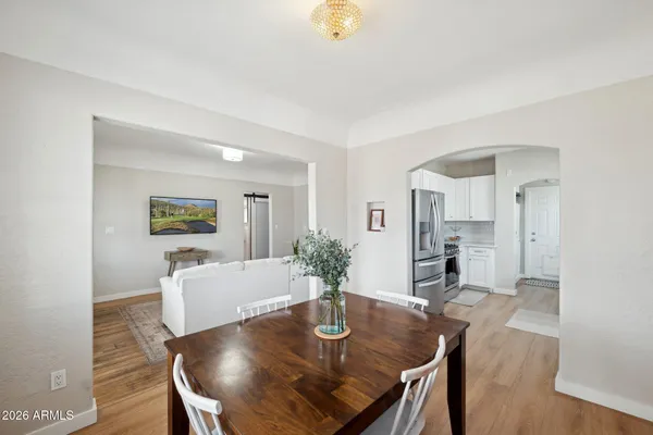 a view of a dining room with furniture window and wooden floor