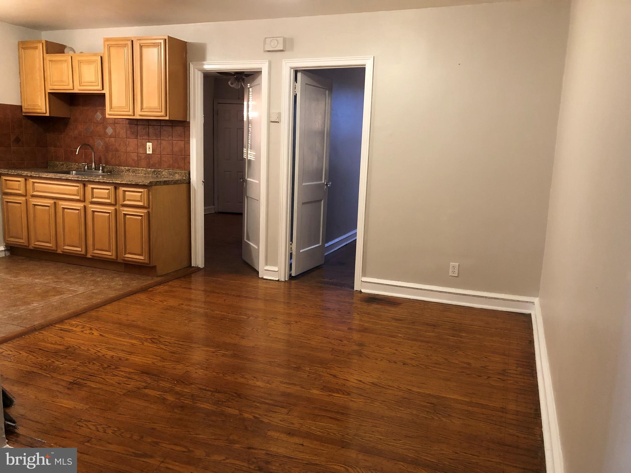 7558 Mayland Street, Unit 2 Philadelphia, PA 19138 - Photo 5 of 8 a view of a kitchen from the hallway