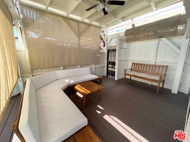 a view of a two chairs in the balcony