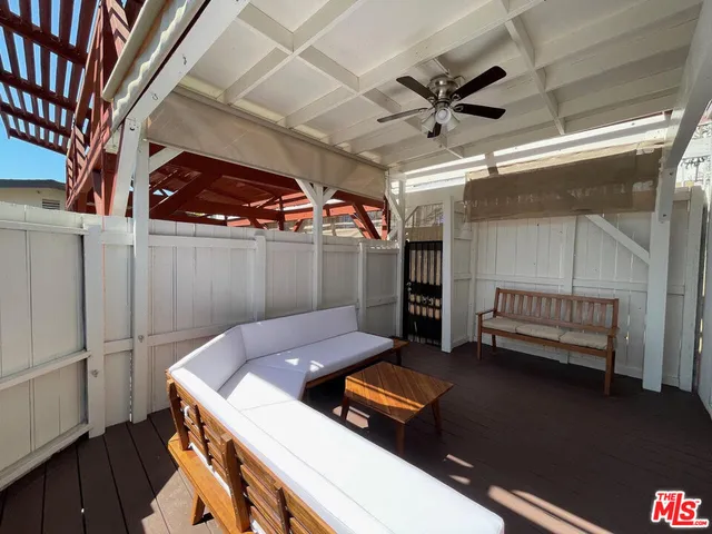 a kitchen with a sink and wooden floor