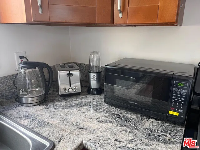 a kitchen with a stove and cabinets