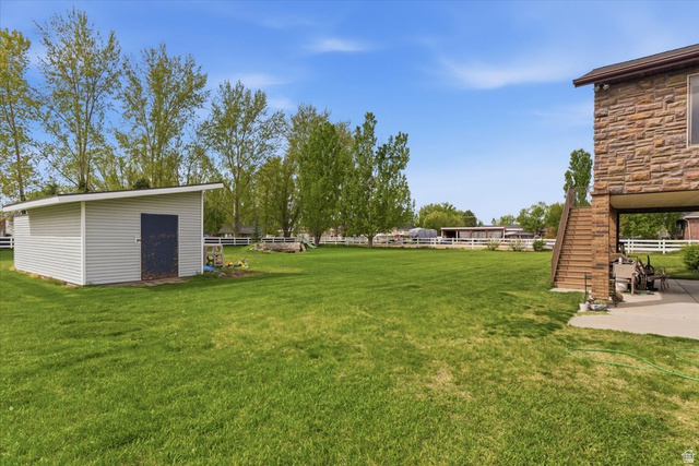 6237 West 4600th Street South Hooper, UT 84315 - Photo 42 of 48 View of yard featuring stairway and an outdoor structure