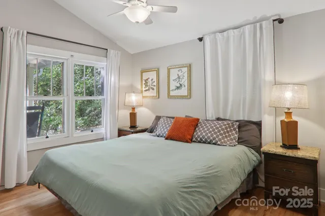 a bedroom with a large bed and a window
