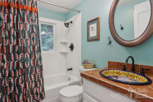 a bathroom with a toilet sink and bathtub
