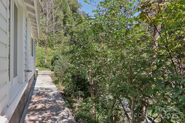 a backyard of a house with a lot of plants