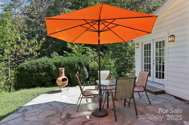 an outdoor space with furniture and umbrella