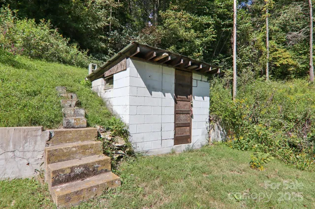 a backyard of a house with table and chairs