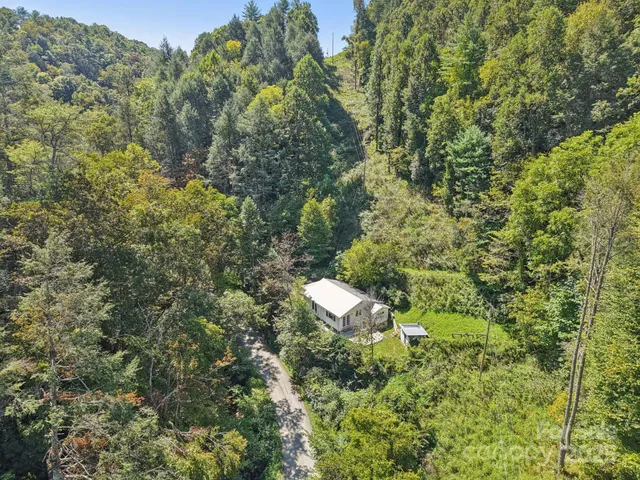 a view of a house in a forest