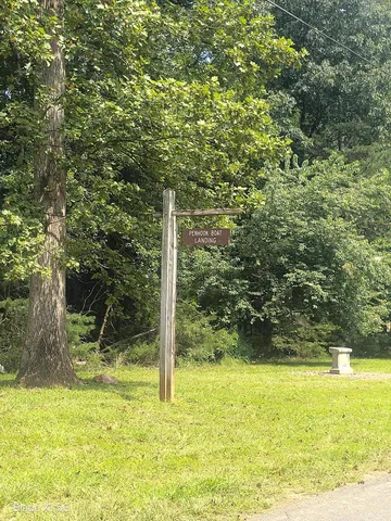 a view of a yard with a tree