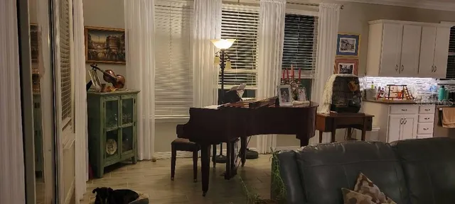 a view of a dining room with furniture and window