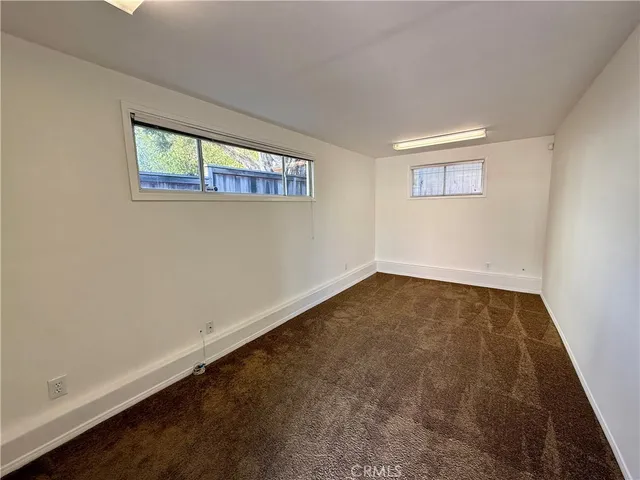 an empty room with a bench