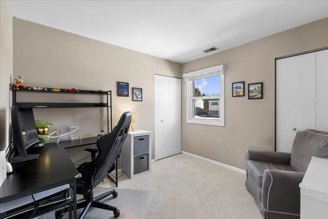 a work room with furniture and a window