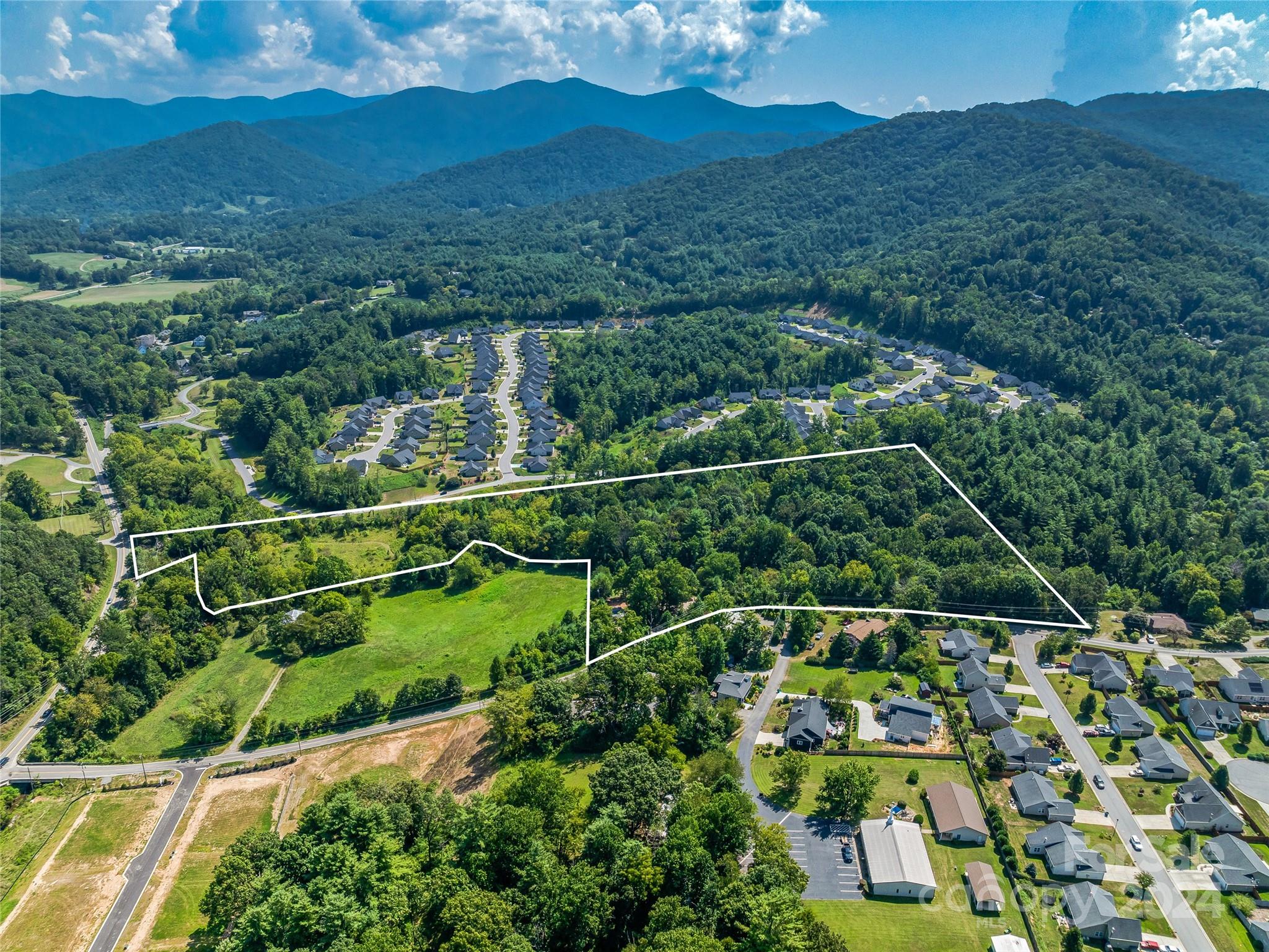 28 Pleasant Grove Road Weaverville, NC 28787 - Photo 4 of 6 a view of a yard with mountain view