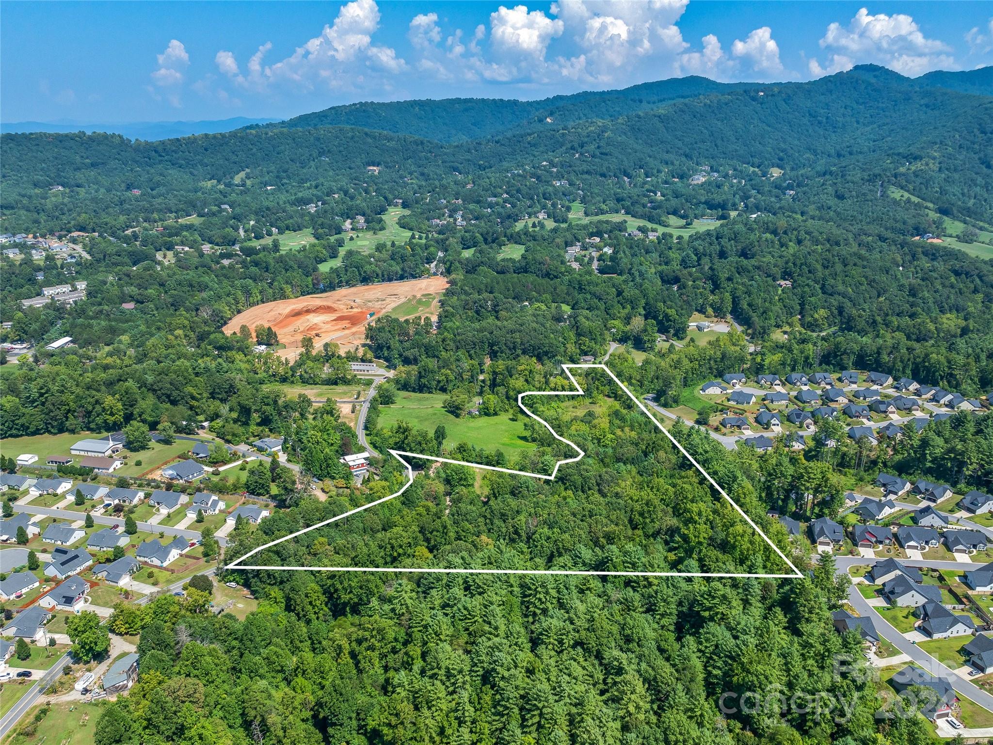 28 Pleasant Grove Road Weaverville, NC 28787 - Photo 5 of 6 a view of a lush green field