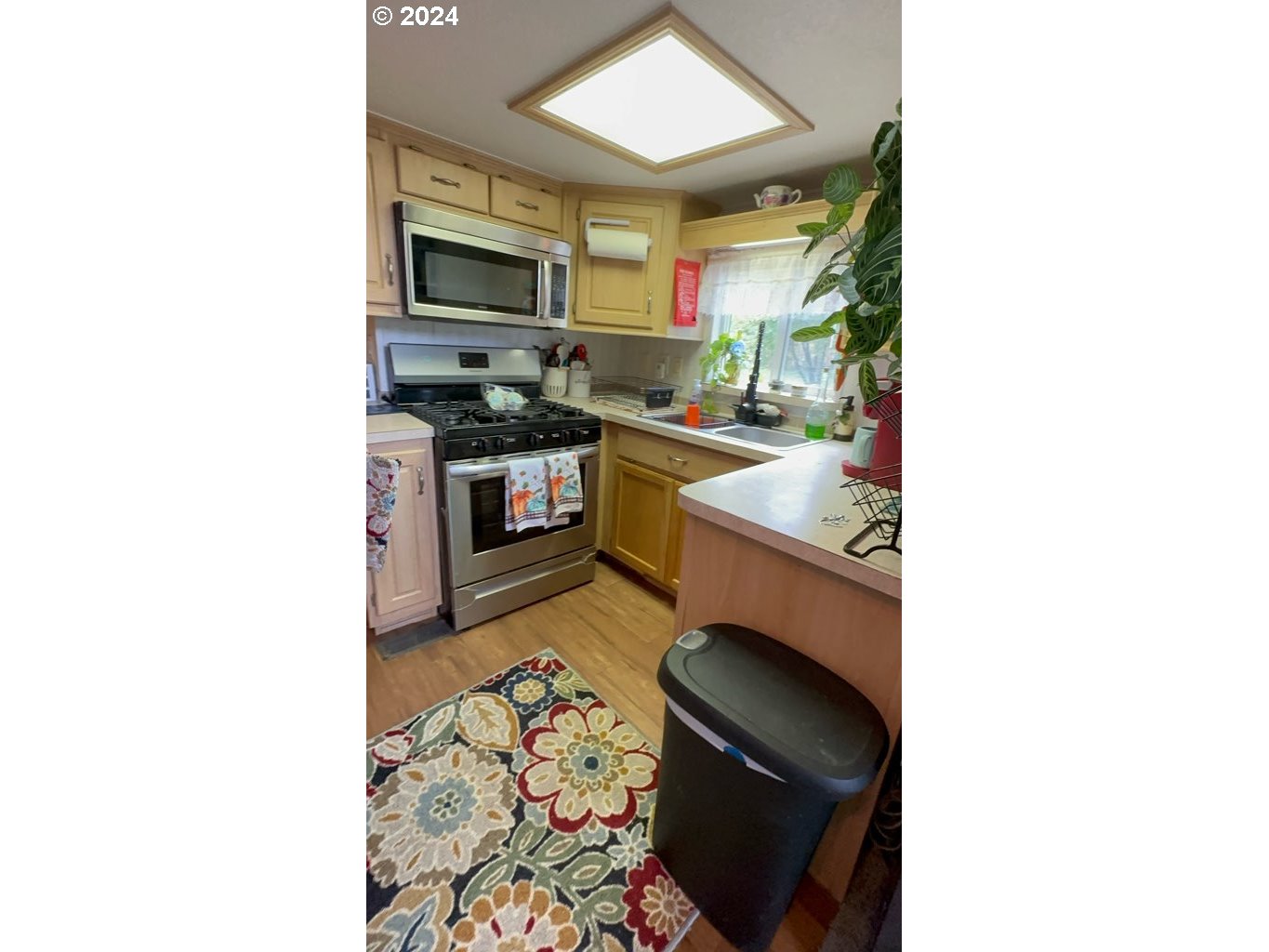 28800 Salmon River Highway Grand Ronde, OR 97347 - Photo 11 of 37 a kitchen with a sink cabinets and stainless steel appliances