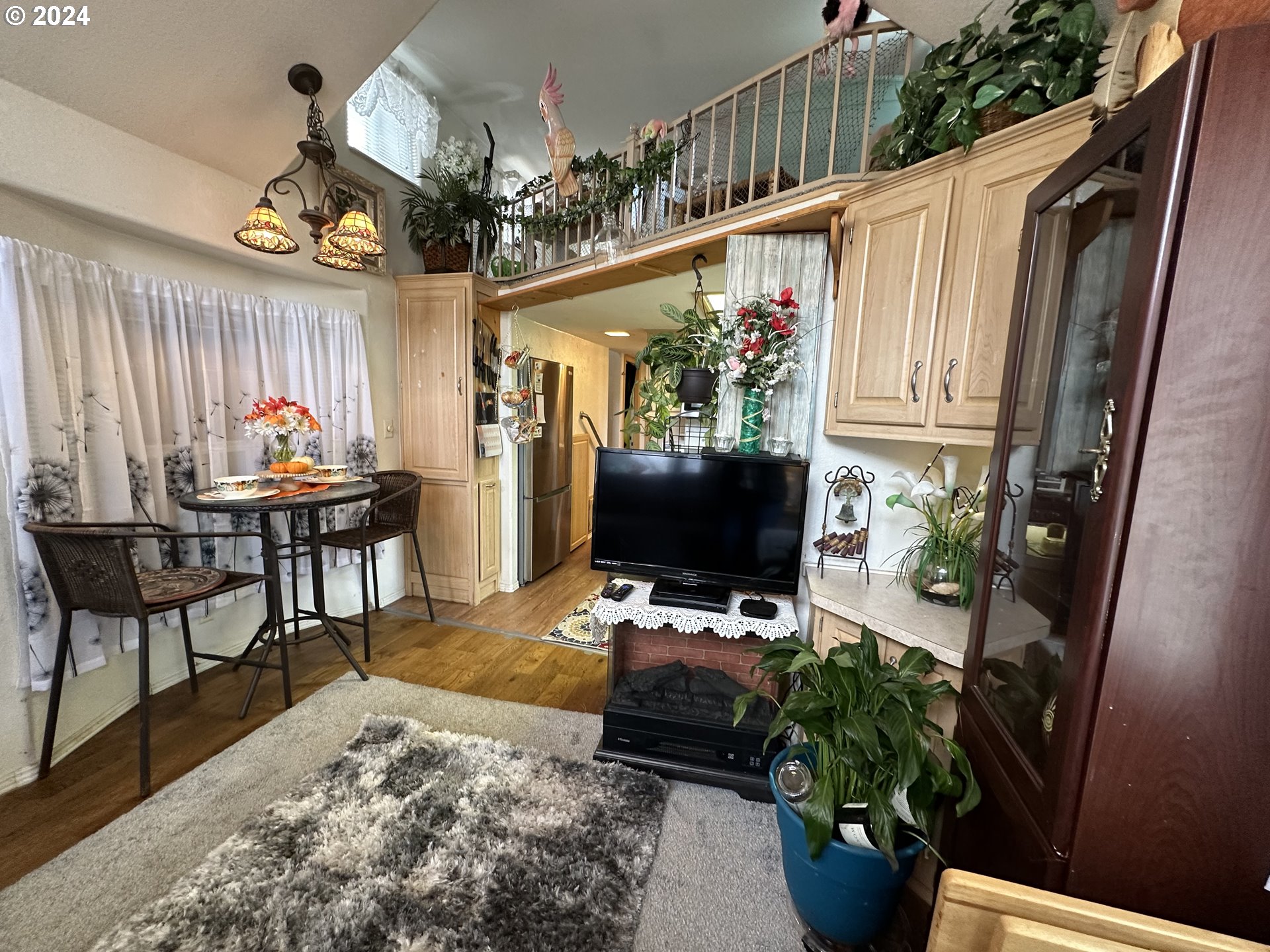 28800 Salmon River Highway Grand Ronde, OR 97347 - Photo 13 of 37 a living room filled with furniture and a flat screen tv