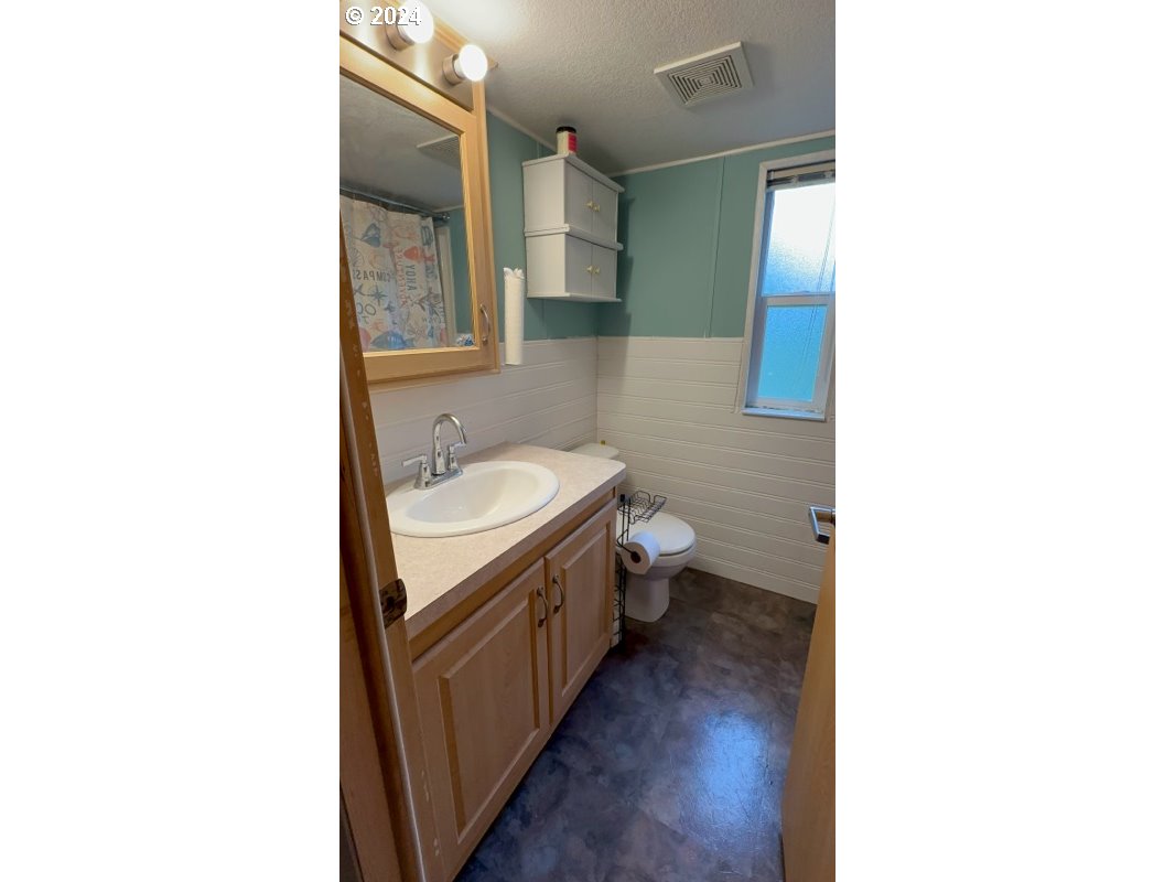 28800 Salmon River Highway Grand Ronde, OR 97347 - Photo 23 of 37 a bath room with a sink and a toilet