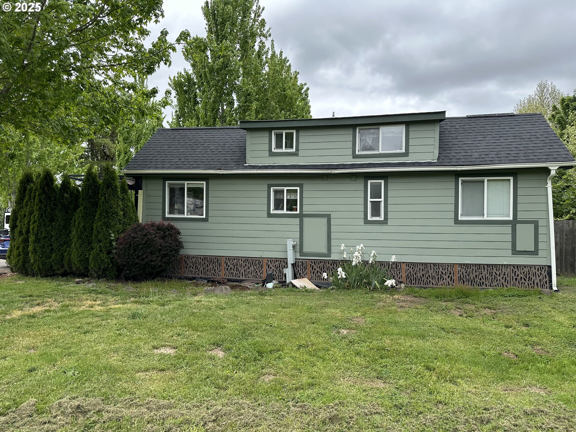 28800 Salmon River Highway Grand Ronde, OR 97347 - Photo 37 of 37 a backyard of a house with potted plants and large tree