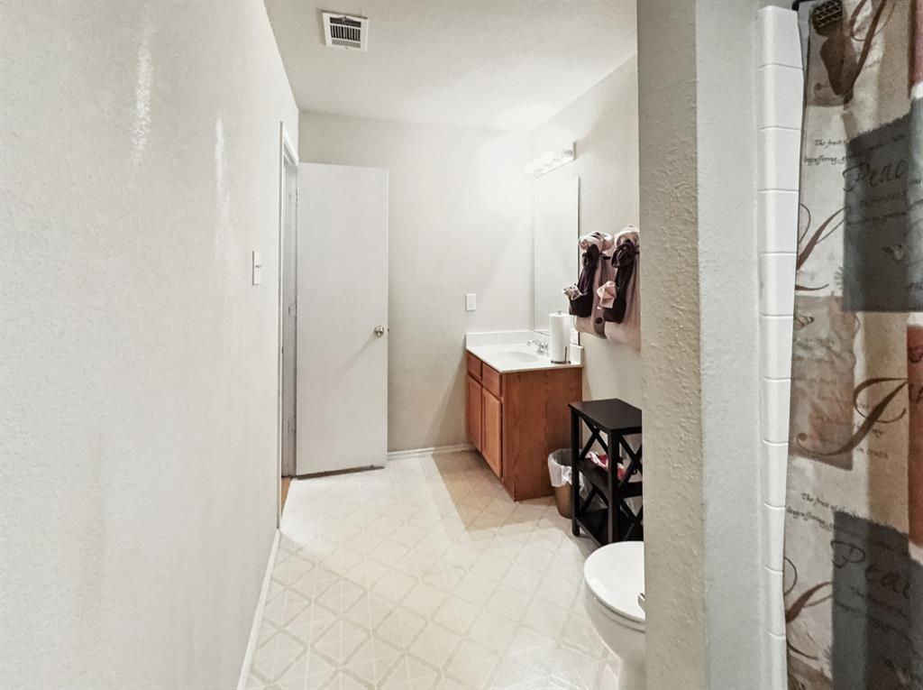 1330 White Tail Ridge Cedar Hill, TX 75104 - Photo 11 of 17 a bed room with a bed and a couch