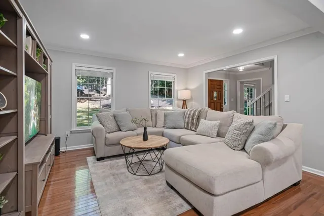 a living room with furniture and a flat screen tv