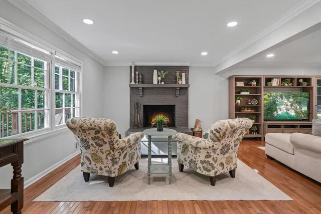 a living room with furniture and a fireplace