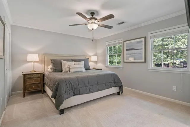 a bedroom with a bed and window