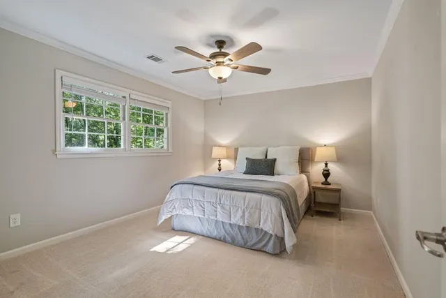 a bedroom with a bed and window