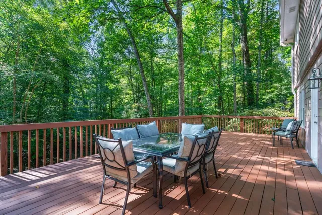 a view of backyard with a deck and hardwood floor