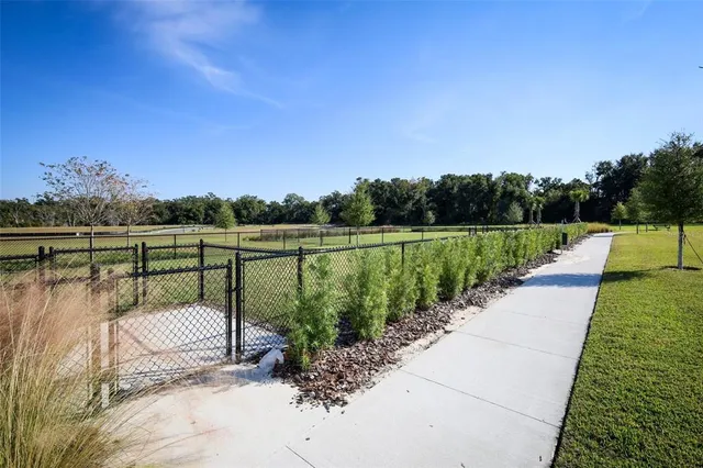 a view of a swimming pool with an outdoor seating