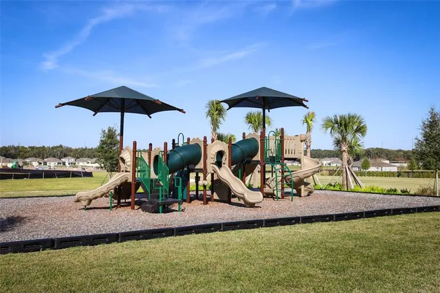 a view of a golf course with a lake view