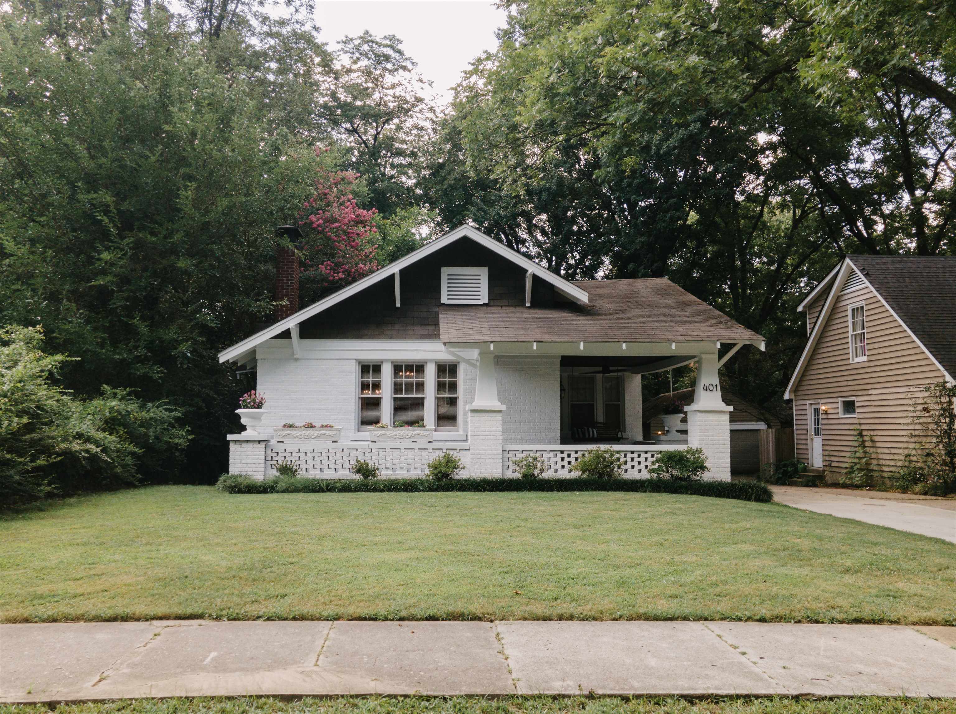 401 Alexander Street Memphis, TN 38111 - Photo 1 of 21 a front view of a house with a garden