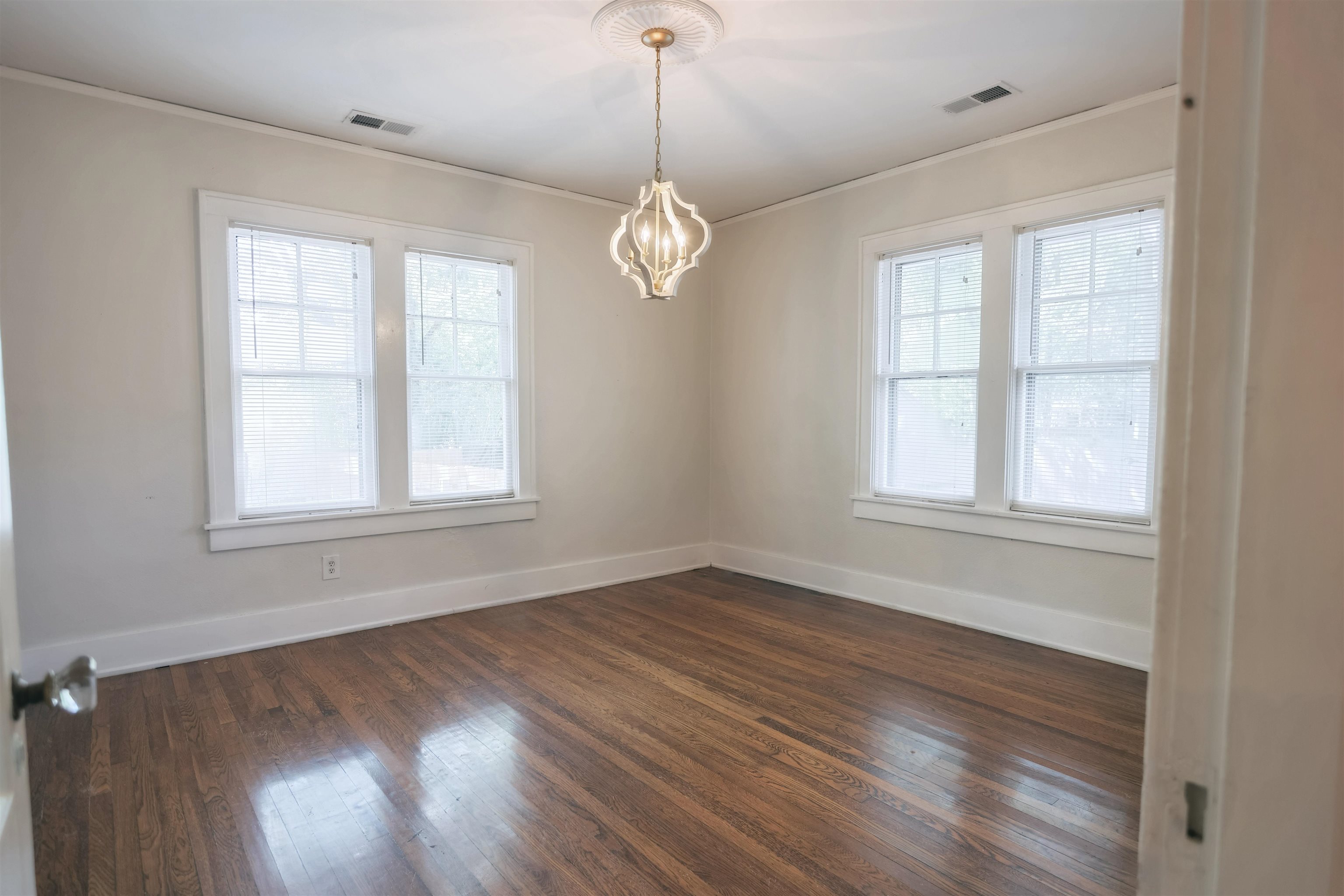 401 Alexander Street Memphis, TN 38111 - Photo 13 of 21 a view of an empty room with wooden floor and a window