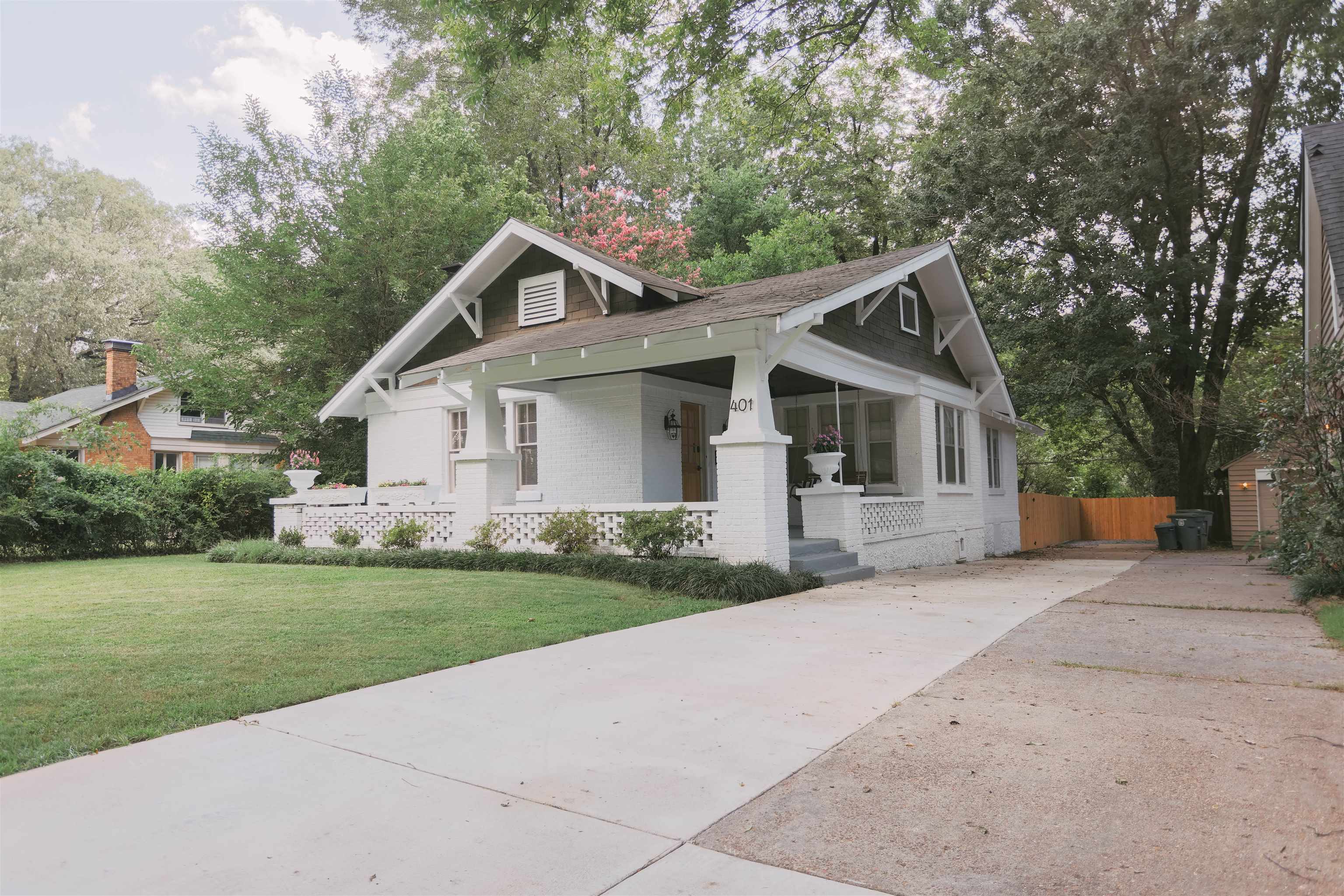 401 Alexander Street Memphis, TN 38111 - Photo 2 of 21 a front view of a house with a yard and garage