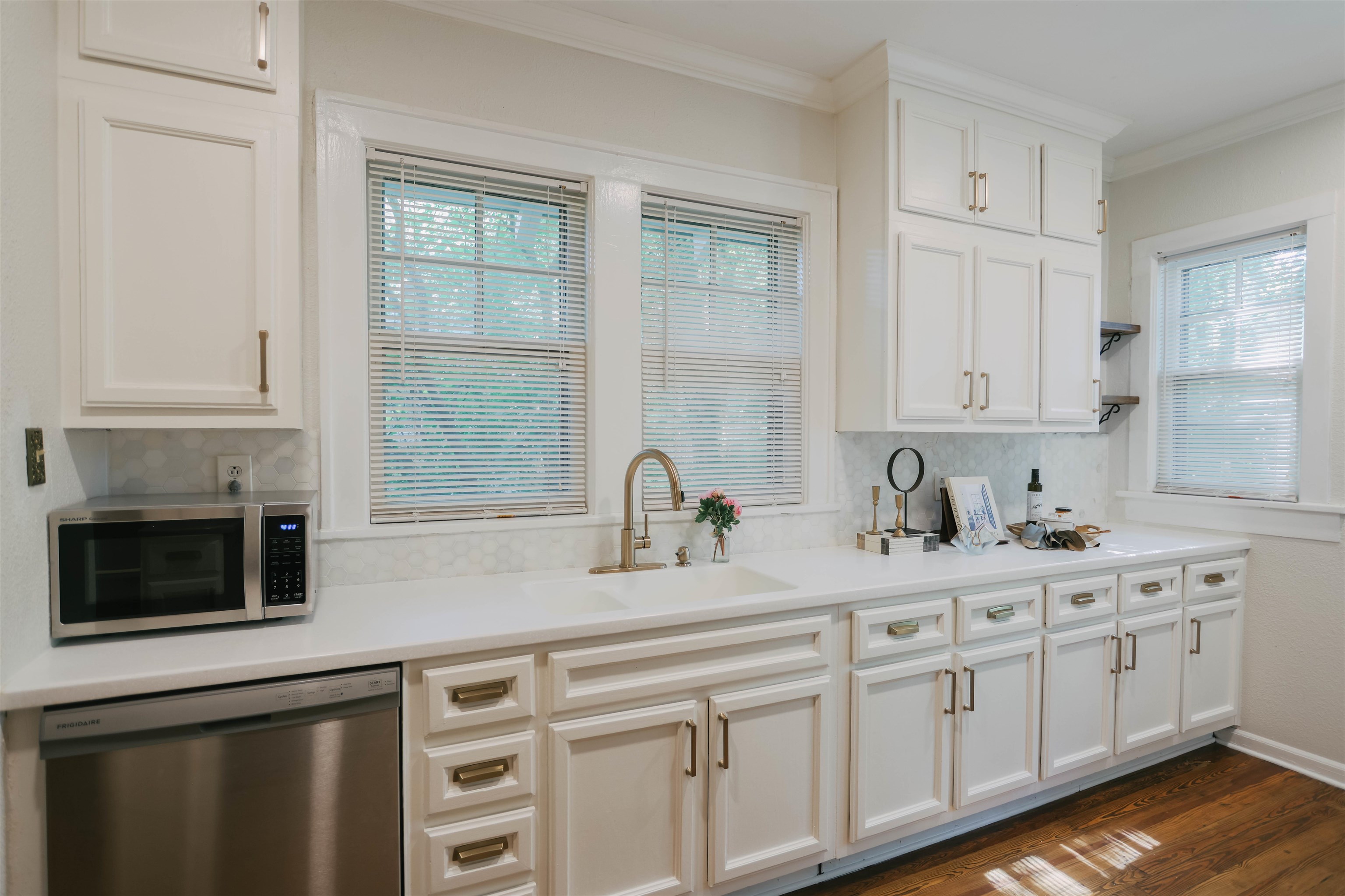 401 Alexander Street Memphis, TN 38111 - Photo 10 of 21 a kitchen with granite countertop a sink stainless steel appliances white cabinets and a window