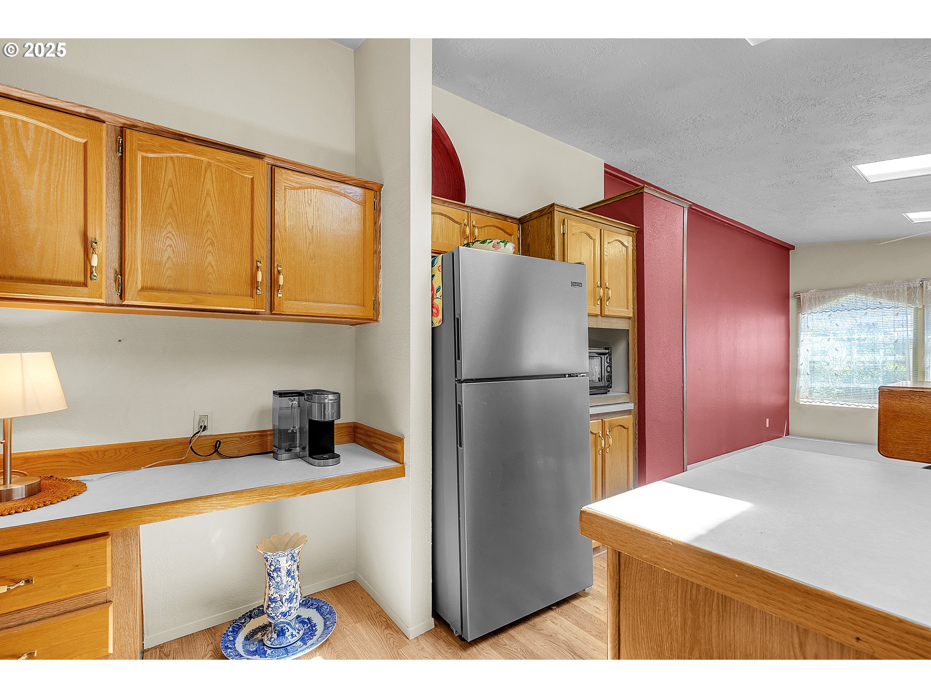 1949 Southeast Palmquist Road, Unit 118 Gresham, OR 97080 - Photo 13 of 32 a kitchen with stainless steel appliances granite countertop a refrigerator a sink and dishwasher