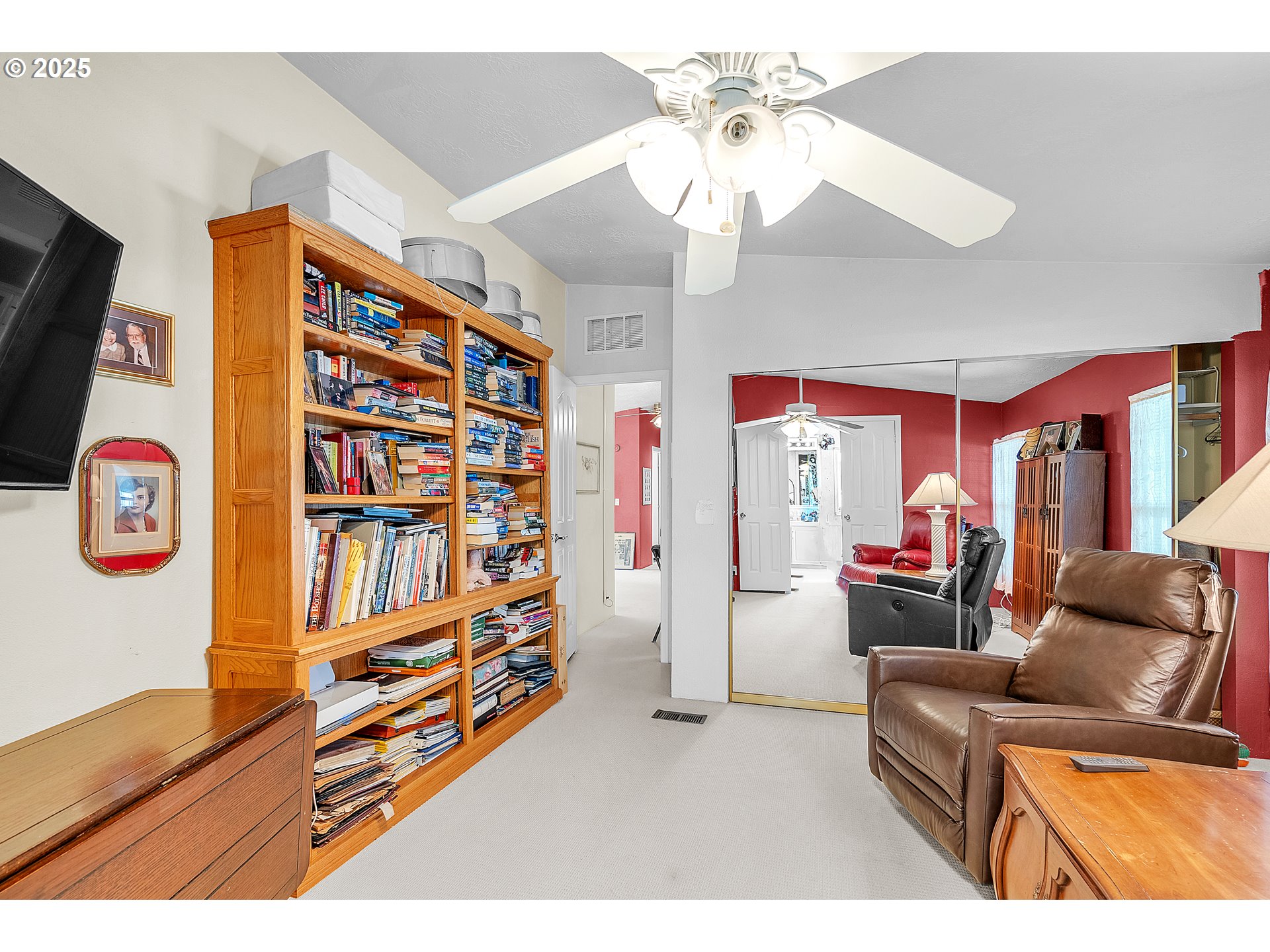 1949 Southeast Palmquist Road, Unit 118 Gresham, OR 97080 - Photo 18 of 32 a living room with furniture and a bookshelf
