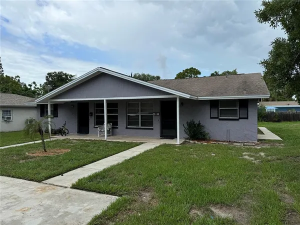 front view of a house with a yard