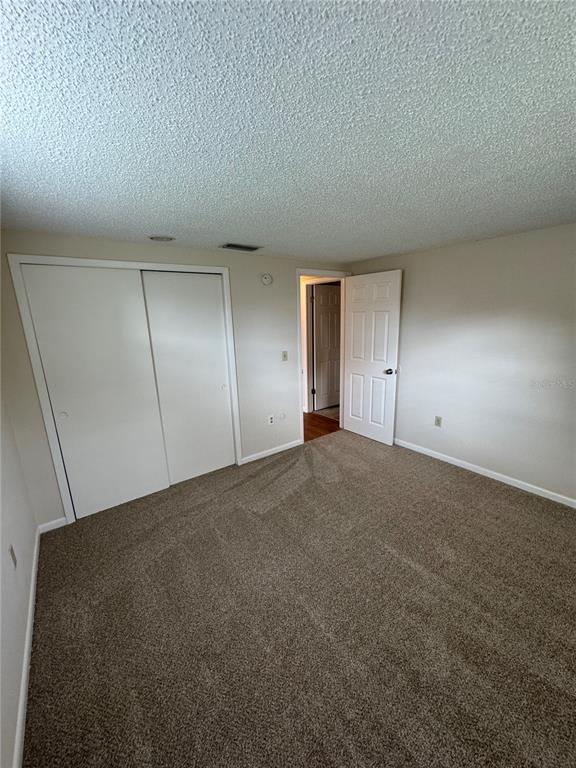 6251 Pennsylvania Avenue New Port Richey, FL 34653 - Photo 8 of 11 a view of an empty room and window