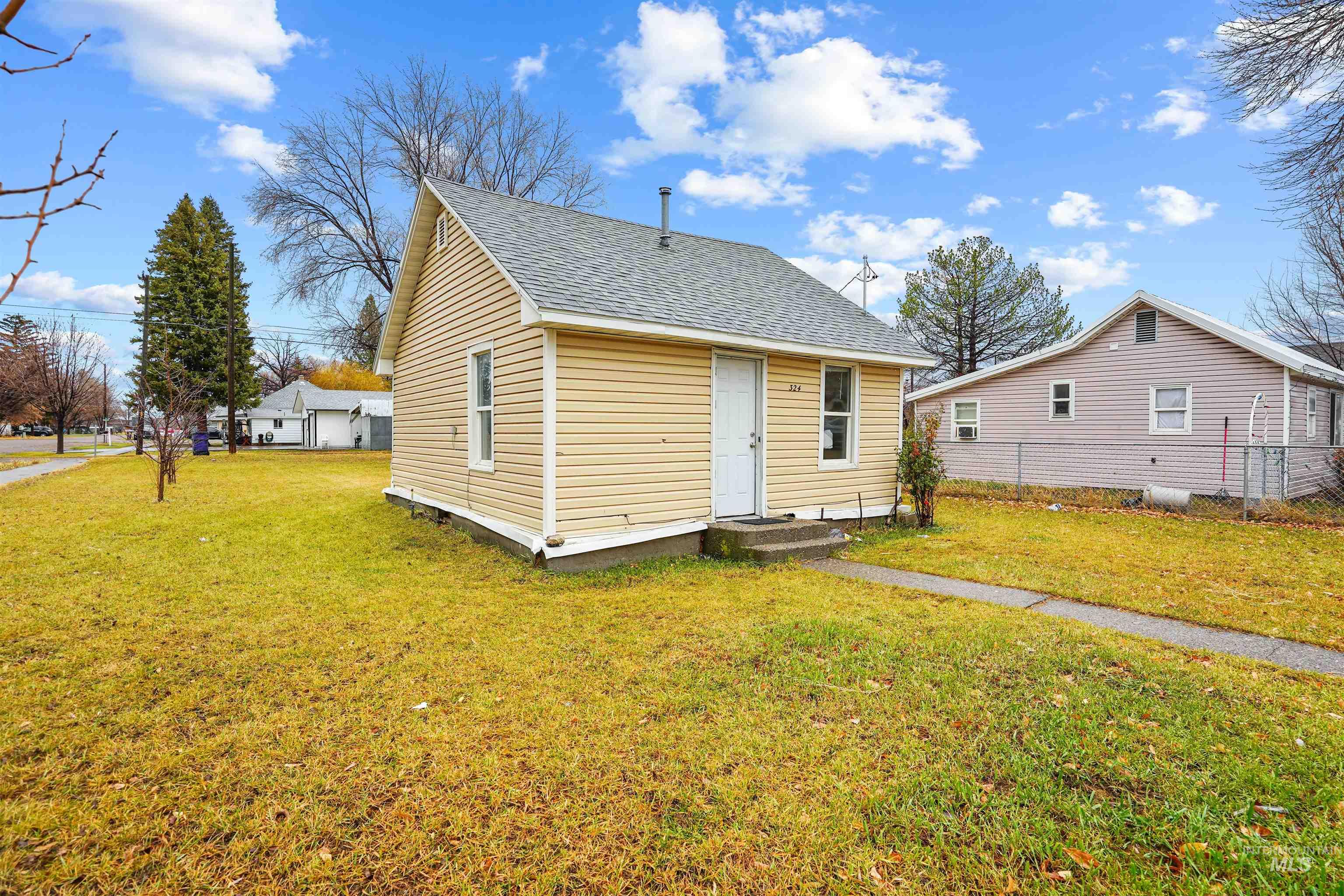 324 Linden Street Rupert, ID 83350 - Photo 11 of 13 View of front of home with a front lawn and roof with shingles
