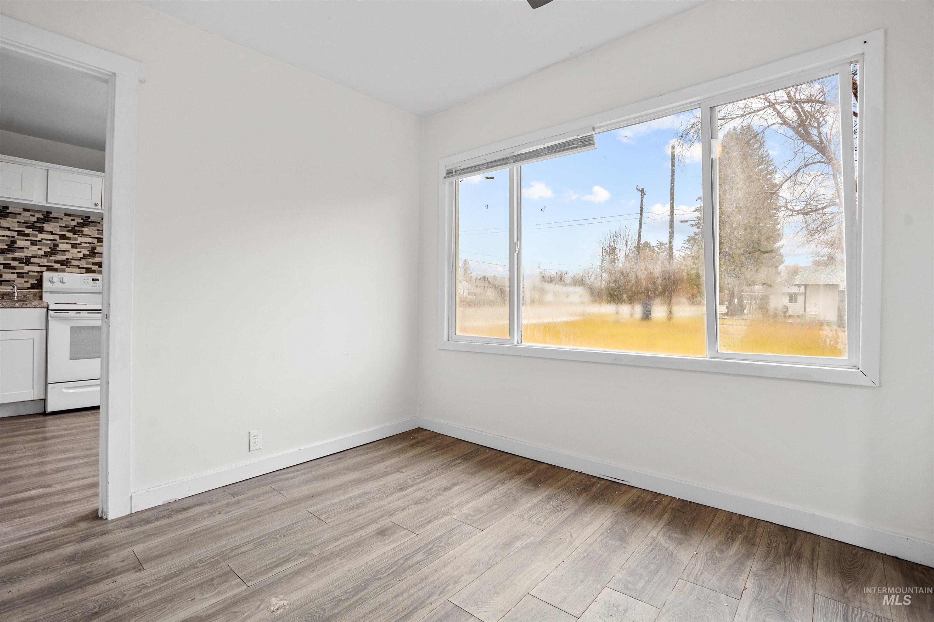 324 Linden Street Rupert, ID 83350 - Photo 7 of 13 Spare room featuring light wood-style floors and baseboards